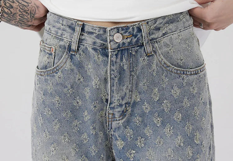 All-Over Monogram Washed Denim Jeans.