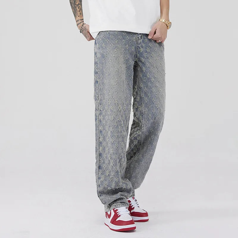 All-Over Monogram Washed Denim Jeans.