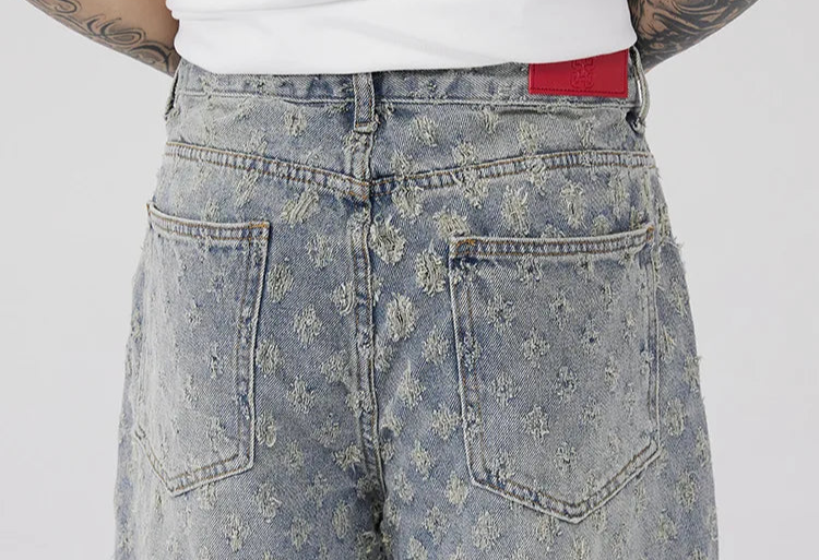 All-Over Monogram Washed Denim Jeans.